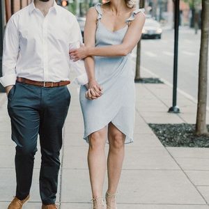 Light blue knee length dress with tie in back. Perfect engagement shoot dress.